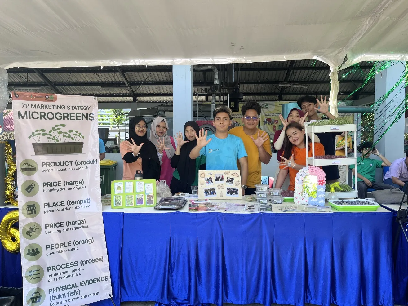 A group of people standing in front of a table AI-generated content may be incorrect.